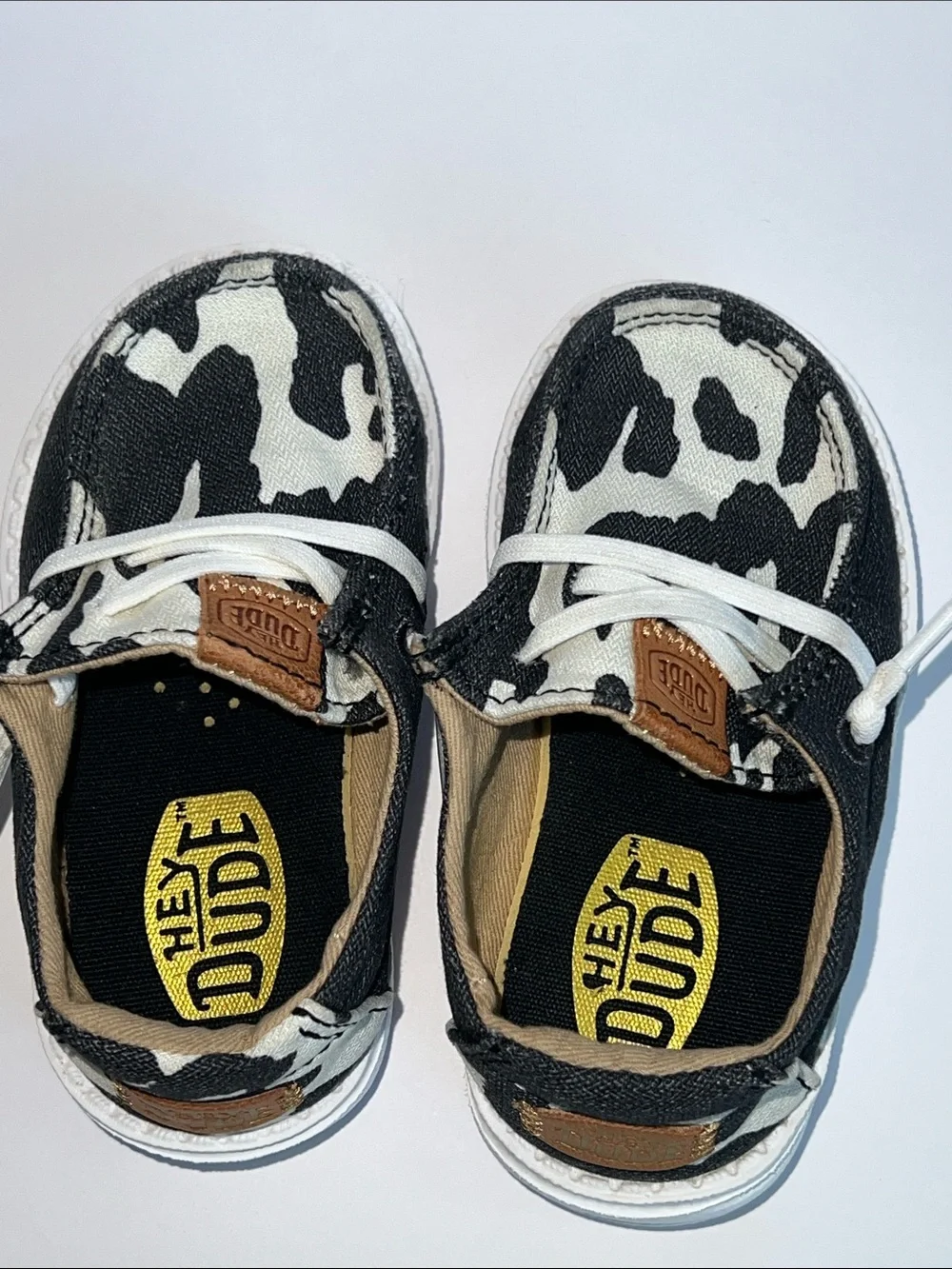 Hey Dude Wendy Black and White Cow Print Slip-On Loafers
